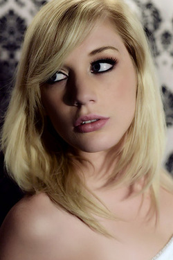 Hayden Hawkens in "Hot Blonde Doll Hayden Hawkens in Sexy Thong And Long Dress in Preening for The Life Erotic" via The Life Erotic